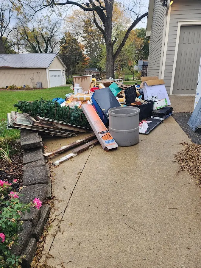 Dumpster being loaded with debris for Estate Cleanout Dumpster Rental in Shaler